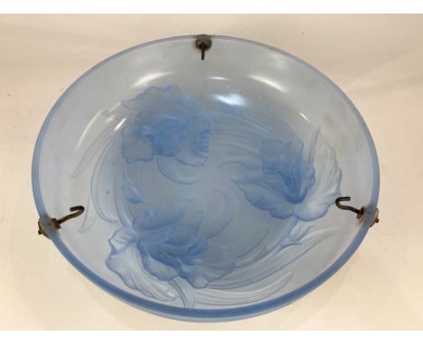 A possibly French Art Deco pressed blue glass light shade, decorated with iris, 36cm diameter