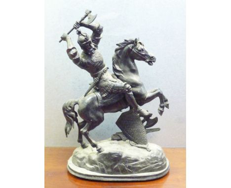 FRENCH SPELTER GROUP OF A SOLDIER ON HORSEBACK WIELDING AN AXE, ON AN OVAL SHAPED BASE (H: 50 cm)