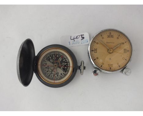 Pocket compass, also a bed side clock    