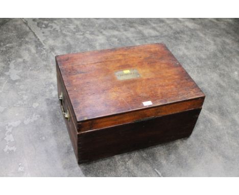 Wooden trunk with brass carrying handles and brass plaque