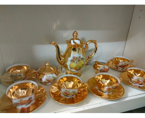 Gilt German porcelain tea service . 