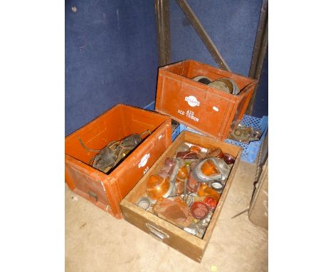 FIVE BOXES OF VINTAGE AUTOMOTIVE PARTS, including head lamps, tail lights, distribution caps, etc