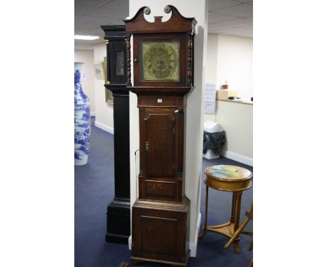 AN OAK LONGCASE CLOCK, the 12' square brass dial, having Roman and Arabic numeral rings with Bell Uttoxeter under, corner spa