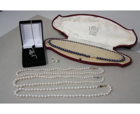 THREE SINGLE ROW CULTURED FRESHWATER PEARL NECKLETS, each strung knotted to a single row clasp, measuring approximately 460mm