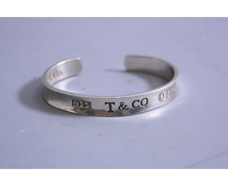 A SILVER TIFFANY & CO BANGLE
