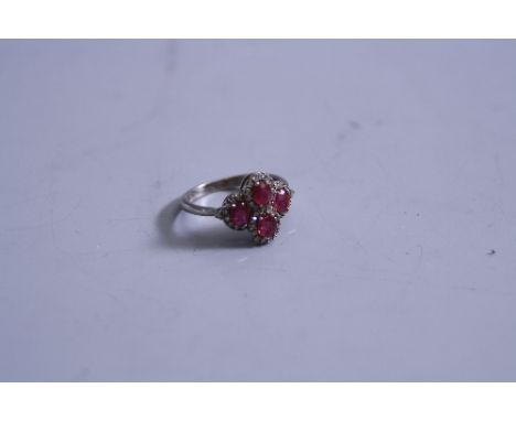 A 9CT WHITE GOLD RUBY AND DIAMOND SET RING, ring size I