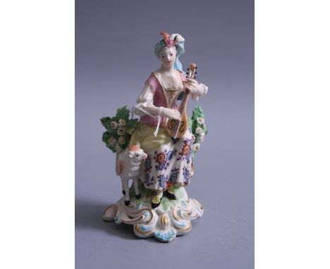 AN 18TH CENTURY DERBY FIGURINE, c.1765-70, musical shepherdess, modelled as shepherdess sat on tree stump playing flute with 