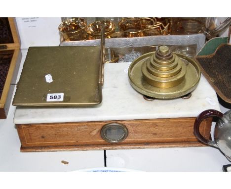 A SET OF EARLY 20TH CENTURY MARBLE AND BRASS MOUNTED SCALES, with a set of weights, width approximately 42cm