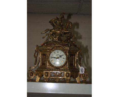 A BRASS CONTINENTAL MANTLE CLOCK, with gentleman on horse shaped finial, dial marked 'Walt', paper label by 'C. Zanard', heig