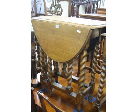 A SMALL OAK BARLEY TWIST GATE-LEG TABLE