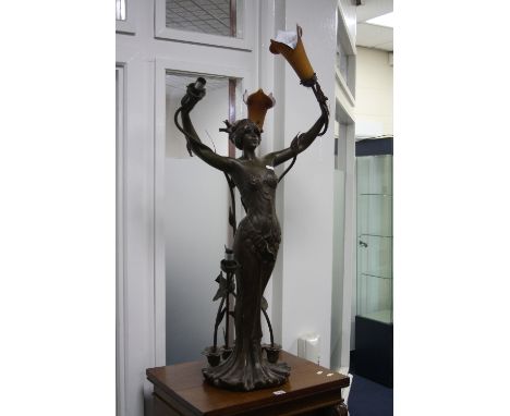 A THREE BRANCH FIGURAL LAMP, modelled as scantily clad Art Nouveau maiden with naturalistic headdress and base, Art d'France 