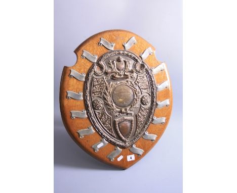 A PRESENTATION CASE SHIELD, having plated mounts to oak shield, inscribed 'Edith Maunder Challenge Shield Present by W R Cart