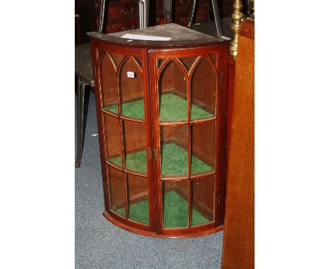 A 19TH CENTURY MAHOGANY INLAID BARREL FRONT GLAZED CORNER CABINET, with string inlaid doors to three shelf interior, approxim