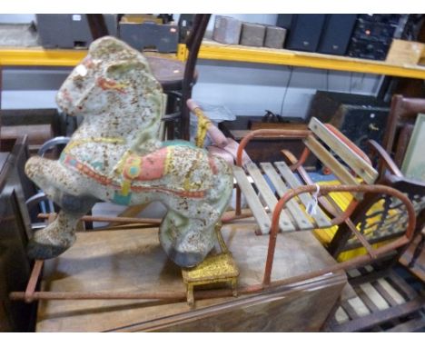 A VINTAGE CHILD'S TIN ROCKING HORSE (sd)