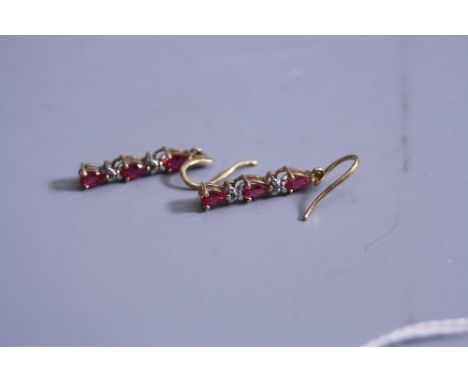 A PAIR OF RUBY AND DIAMOND 9CT EARRINGS