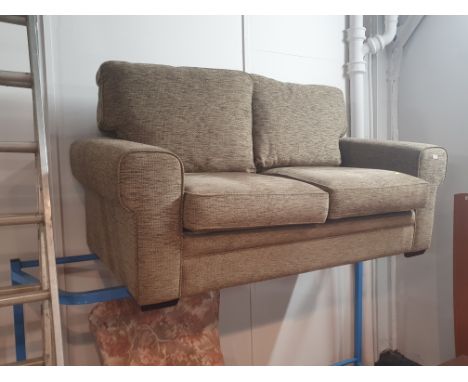 A green fabric two seater sofa bed 