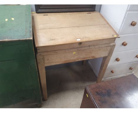 A pine clerk's desk raised on square tapering legs 