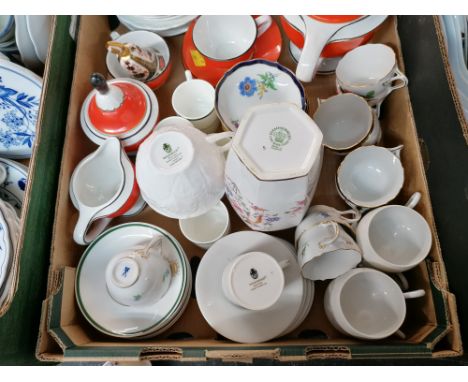 Two boxes of oriental rice bowls and spoons, fish decorated casserole dishes, teacups and saucers 