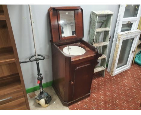 A Victorian mahogany washstand with integral basin