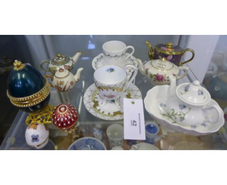 Mixed lot to include miniature porcelain and cloisonne teapots, enamelled eggs and cabinet cups and saucers (a lot)