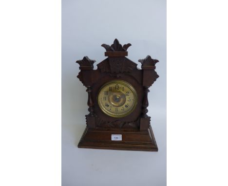 A carved mahogany mantle clock, the gilt dial with Roman numerals 30 x 40cm 