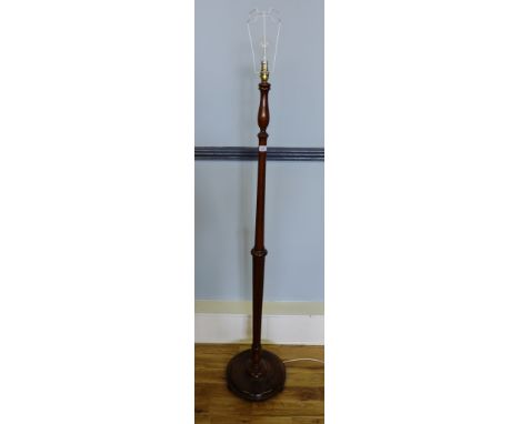 A mahogany standard lamp 177cm high