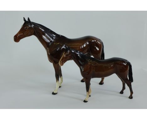 A large Beswick figure of a brown horse in a high gloss glaze together with another smaller (2) tallest 29cm high