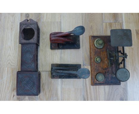 A box containing  cast metal press stamps, pocket watch holder, scales, etc  