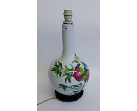 White glazed table lamp base with fruit and flower decoration, on a hardwood stand, 40cm high