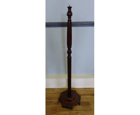A mahogany standard lamp 144cm high