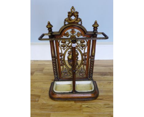 A Victorian cast iron stick stand complete with drip trays, 47 x 73cm