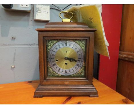 A Howard Miller bracket clock in the Georgian style 