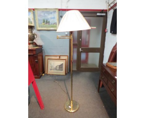 A brass swivel reading lamp with pleated shade 