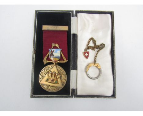 A Masonic silver gilt medal with enamel decoration 