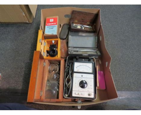A box of scientific instruments, glass lenses, etc 