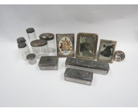 Three silver photo frames together with one other, and a selection of silver and plated dressing table pots 