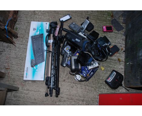 2 x camera tripods, quantity of cameras and a keyboard.