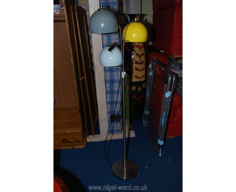 A triple headed standard lamp.