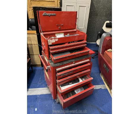 A Red Snap-On Tools Tool Chest on Casters with keys and various tools including various Snap on sockets , Blue-Point Dr. Pass