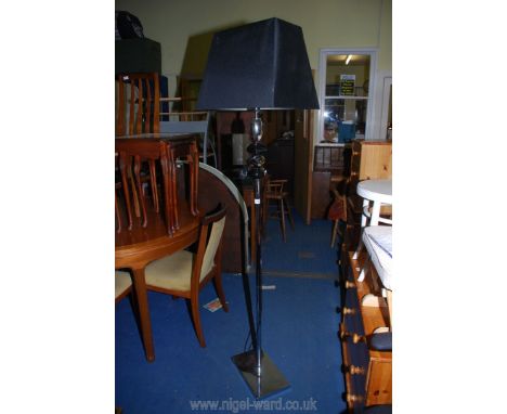 A chrome standard lamp