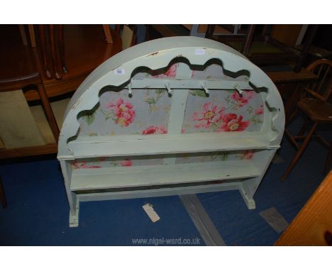 A painted and floral decorated kitchen display shelf