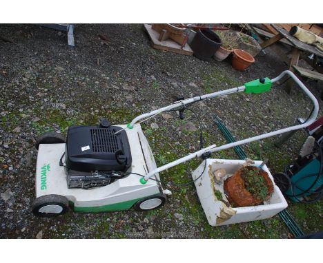 A Viking petrol engine rotary mower, engine turns and has good compression but no fuel, so not started.