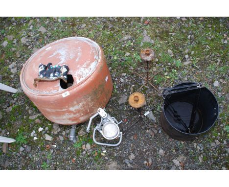 An alloy water header tank, a metal sculpture, brackets, iron candle-sticks, etc.,