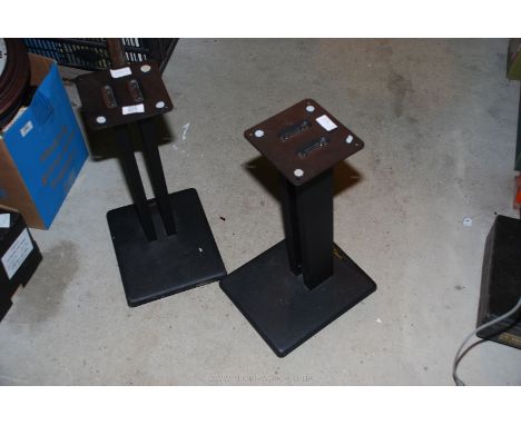 A pair of metal speaker stands.