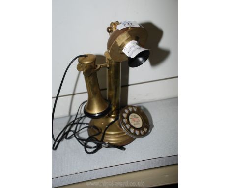 A reproduction candlestick telephone