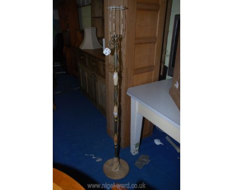 An onyx and brass finished standard lamp