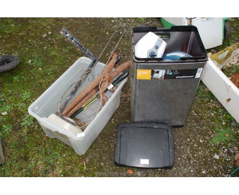 A kitchen bin, a blender, horse hames, a lamp bracket, etc.,