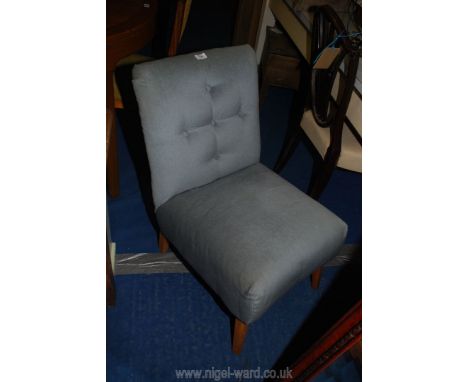 A button back nursing chair