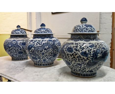 JARS WITH COVERS, a set of three, Chinese export style, blue and white ceramic, 37cm H. (3) 