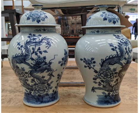 TEMPLE JARS, a pair, Chinese export style, blue and white ceramic, dragon decoration, 39cm H. (2) 
